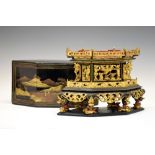Late 19th or early 20th Century Chinese black lacquer and gilt model of a pagoda or pavilion, with
