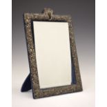 Victorian silver easel dressing mirror, the border having embossed floral and bird decoration, the