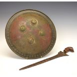19th Century Indian shield 'dhal', made of brass and decorated with flowers and foliage against a