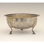 George V Irish silver bowl, having embossed decoration of rural life, with beaded border and