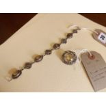 SILVER & QUARTZ ROUND BROOCH & A CELTIC SMOKEY QUARTZ BRACELET EST [£15- £25]