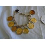 9 CT GOLD CHARM BRACELET MOUNTED WITH 4 GOLD SOVEREIGNS 2 HALF SOVEREIGNS & A PERUVIAN LIBRA ,2