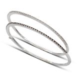 Two 18kt white gold and diamond bangle bracelets weight 17,6 gr.