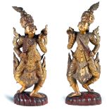 Pair of gilt and lacquered wood sculptures Oriental manifacture, 20th centuty h. 102 cm.
