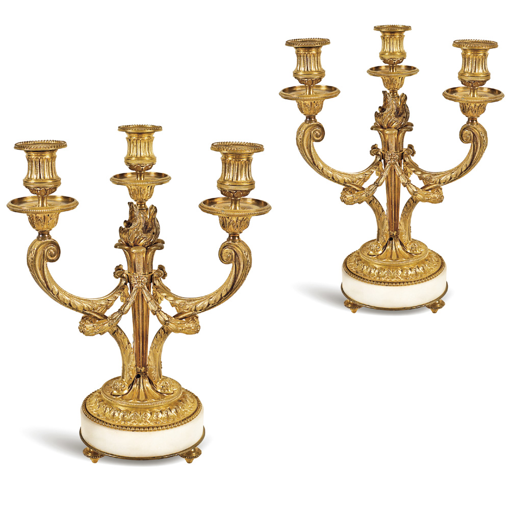 Pair of gilt bronze three-lights candelabra France, 19th- 20th century 34x25 cm.