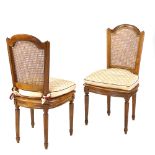 Twelve walnut chairs France, 20th century h. 98 cm.