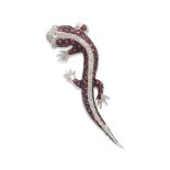 18kt white gold, rubies and diamond geco brooch weight 21 gr.