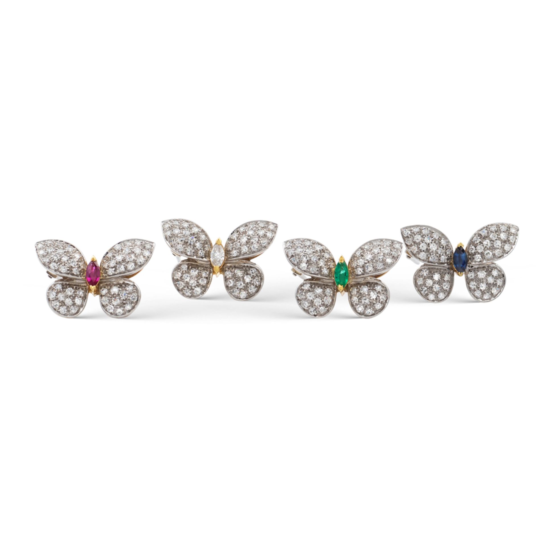 Four 18kt two color gold and diamond butterfly brooches weight 19,8 gr.