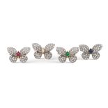 Four 18kt two color gold and diamond butterfly brooches weight 19,8 gr.