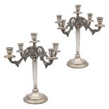 Pair of silver candelabra Italy, 20th century 37x32 cm. resting on circular bases, shaped arms,