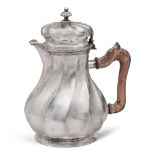 Silver coffeepot Italy, 20th century h. 19 cm. torchon body, shaped wooden handle, weight 510 gr.