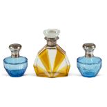 Group of perfume bottles (3) Italy, 20th century h.15 e 10,5 cm. colored glass bodies, silver and