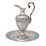 Silver jug with presentoire Italy, 20th century h 26 cm. - d. 25 cm. body engraved with floral and