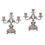 Pair of three-lights silver candelabra Italy, 20th century 21,5x20,5x9,5 cm chiseled body with