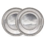 Pair of circular silver plates Italy, 20th century d. 31 cm. plain bodies with knurled profiles,