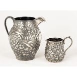 Two Sterling Repoussé Pitchers