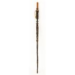 Figural Carved Wooden and Hide Staff