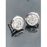 Pair of 14k White Gold Round Cut Diamond Earrings