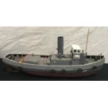 A large hand built grey painted model of a single funnel Tug. Approx 90cms.