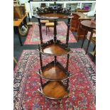 An antique mahogany graduated corner Whatnot hallway storage unit with four shelves. H:141 W:59 D: