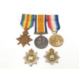 WWI campaign medal group to W Harrington RE and two cap badges.