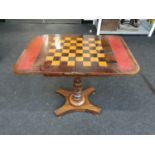 An Edwardian mahogany fold over games table. H:61 W:46 D:34 (cm).