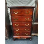 A Victorian mahogany tall bedroom chest of five drawers with brass handles to front. H:111 W:65 D:44