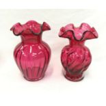 Two small fluted Cranberry glass vases.