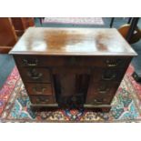 A Victorian mahogany ladies writing desk fitted with three drawers each side, large drawer to top