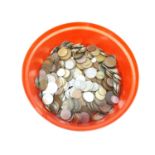 A red tub of assorted coins.