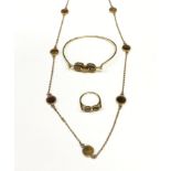 A suite of yellow gold Tigers Eye jewellery to include ring, Necklace and bracelet.