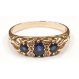 A 9ct gold Sapphire and Diamond gypsy ring, Size N