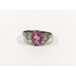 A pink sapphire 9ct gold trilogy ring, Size K 1/2.