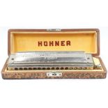 A Hohner 64 chromonic harmonica.