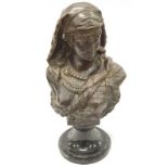 Bronze bust of a lady.