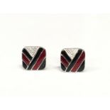 A pair of silver and enamel set cased cufflinks.