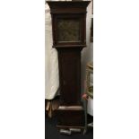 An oak cased grandfather clock.