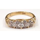 An 18ct gold 0.7ct five stone diamond ring, Size L.