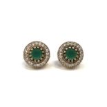 A pair od silver CZ and faux emerald renaissance style stud earrings cased.