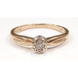 A 9ct gold diamond solitaire illusion ring, size M 1/2.