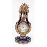 An ornate blue and gilt V&A Marie-Antoinette clock - 38cm high.