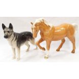 A Beswick Palomino pony with German shepherd dog.