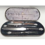 A solid silver Victorian carving set by the Mappin Brothers to include sets for lamb and beef.