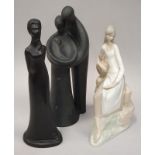 Three figurines: Nao, Royal Doulton "Family", and one other.