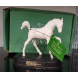 A Royal Doulton figure of a horse on wooden base : Springtime.