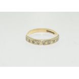 A 9ct diamond half eternity ring, Size O.