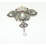 Silver Art Nouveau style brooch set with Marcasites and opal cabochon.