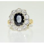 A ladies 18ct antique diamond and sapphire cluster ring, approx 1ct, Size M.