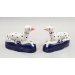A pair of Staffordshire dogs, marked "M" or "W"? to the bases.