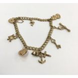 9ct yellow gold charm bracelet - 8 charms.